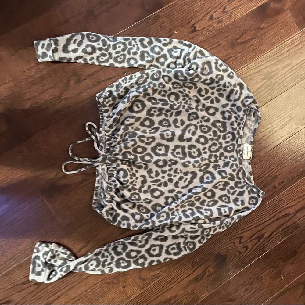 Cheetah print long sleeve shirt, thin, and is slightly cropped.